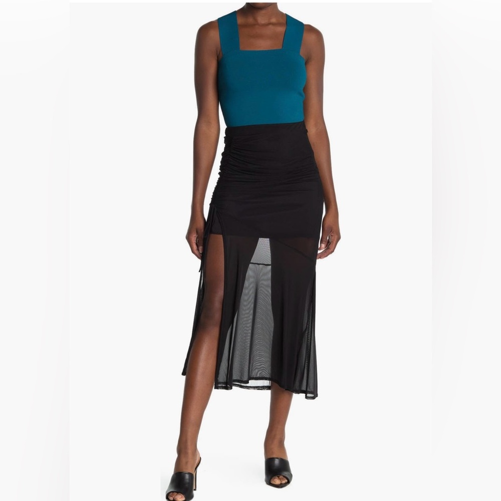 Black skirt with mesh bottom. Cinch partial on the side.